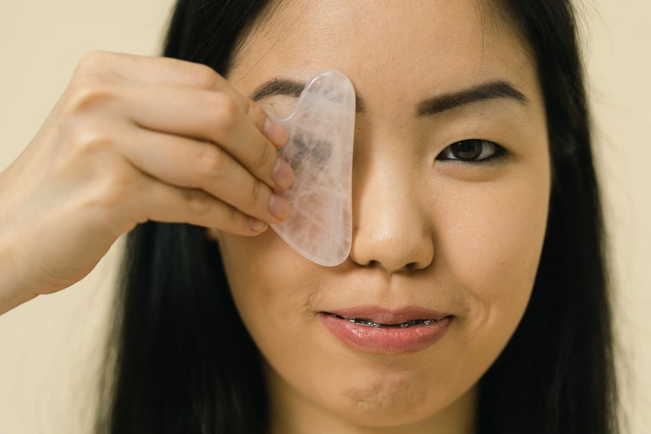 Compact microcurrent facial device on a skincare shelf