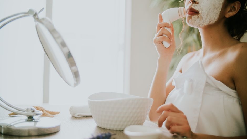 Silicone facial cleansing brush during a skincare routine